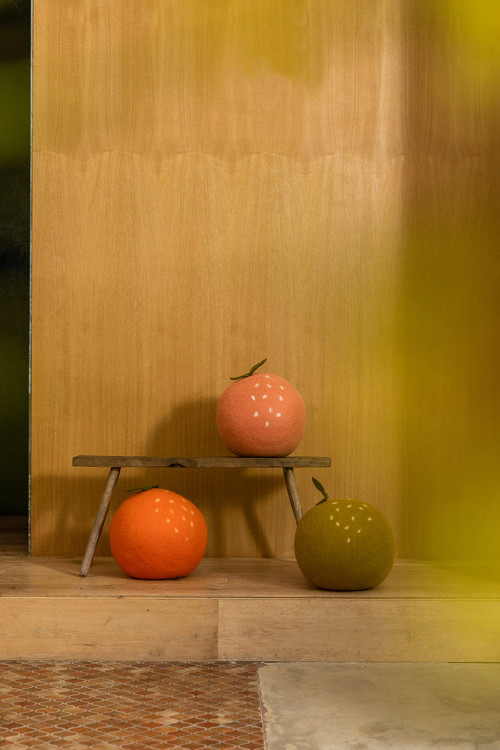 Happy atmosphere in a child's room with the felted apple pouffe