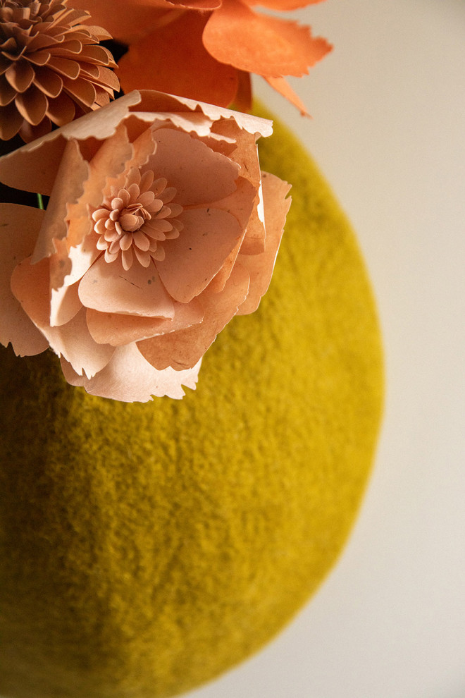 a white wool storage basket to hang anywhere in the house