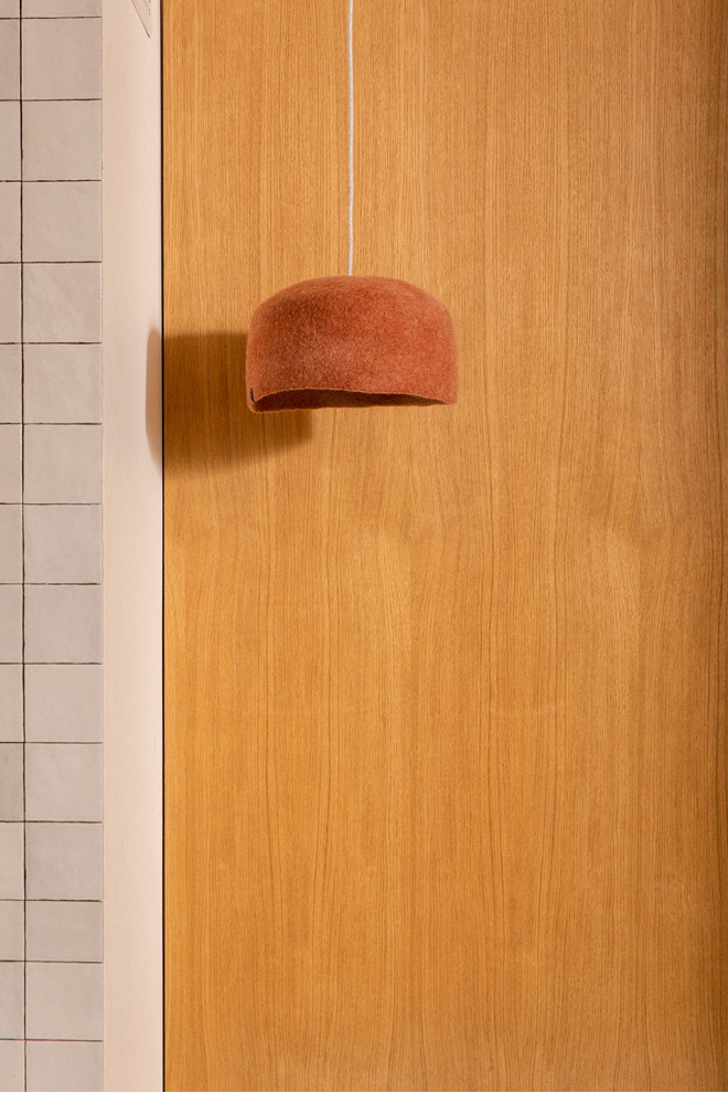 Trio of wool felt shades above the dining table