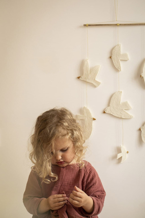 A felt and bamboo bird mobile for a children's bedroom