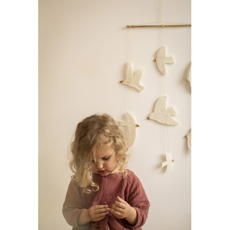 A felt and bamboo bird mobile for a children's bedroom