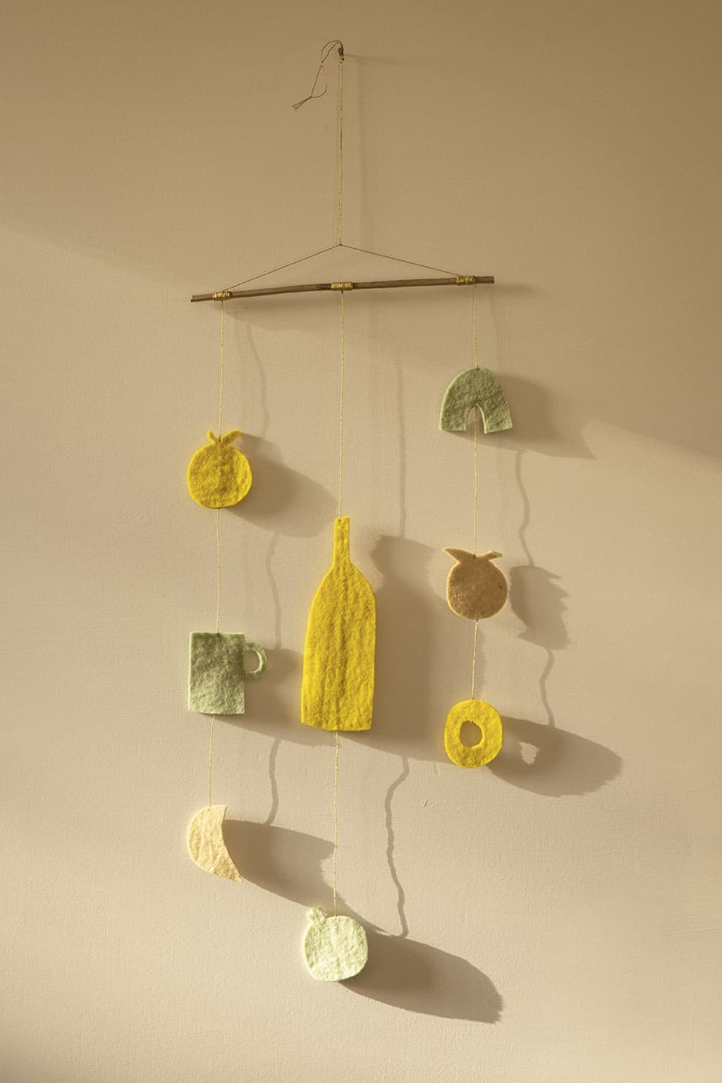 A colourful, handmade felt mobile to liven up your home decor