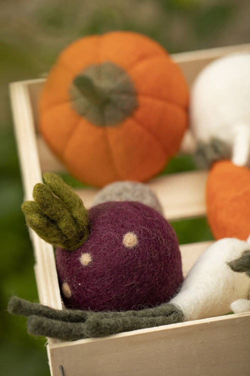 vegetables made of felt in a wooden box