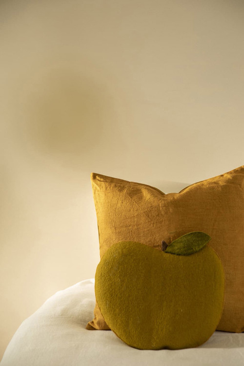 Felt apple cushion to decorate the bed