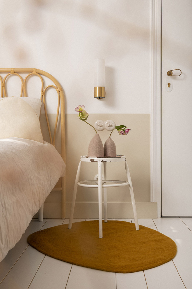 Duo of natural felt pebble rugs on the way to the bathroom