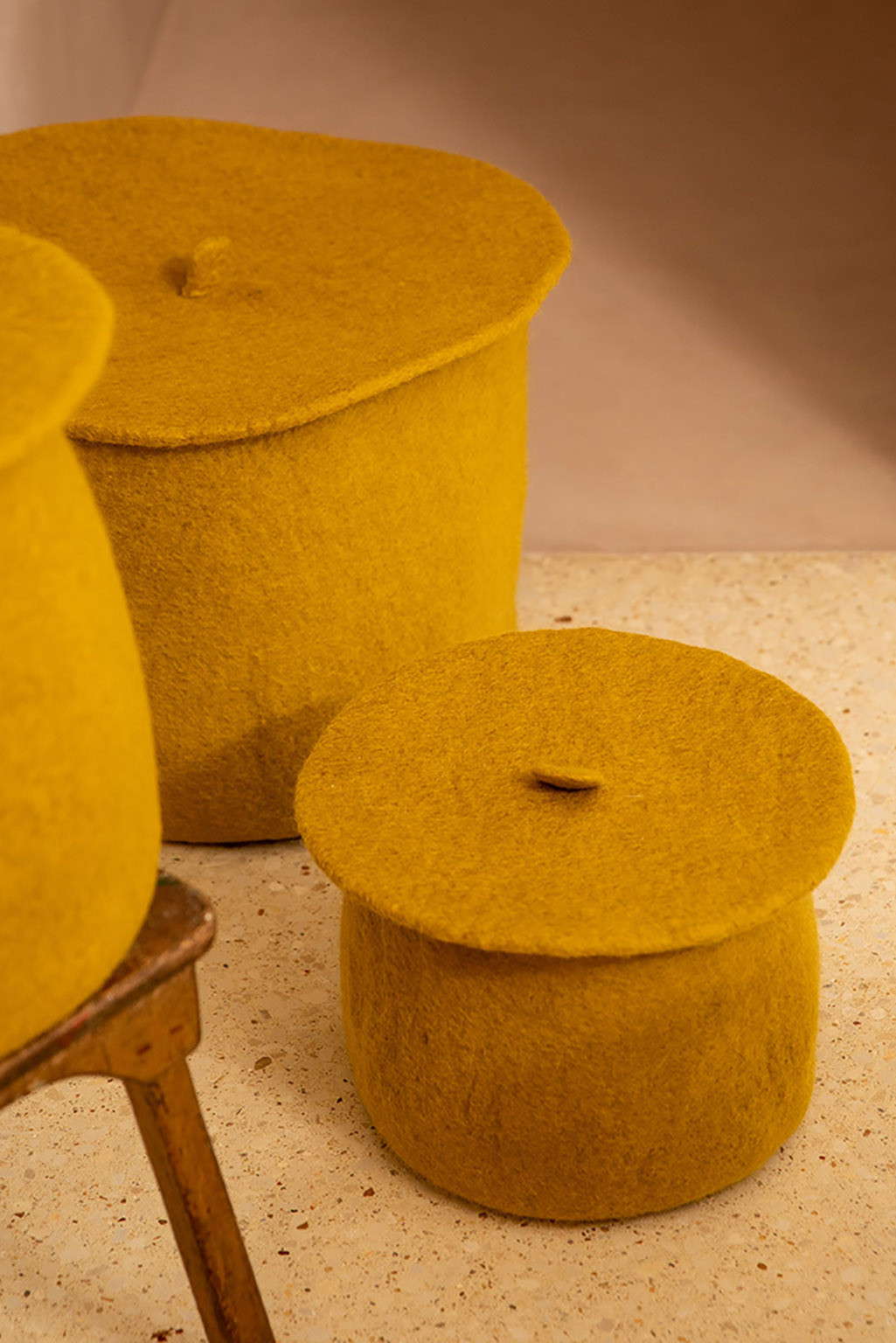 ochre felt storage baskets with their lids
