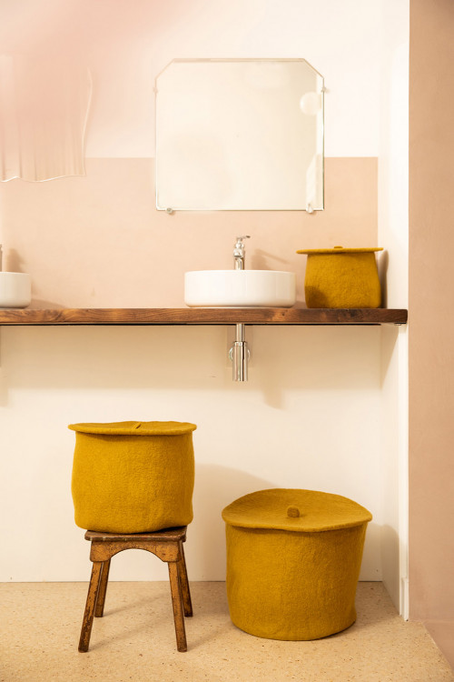 3 round felt mustard baskets in the living room