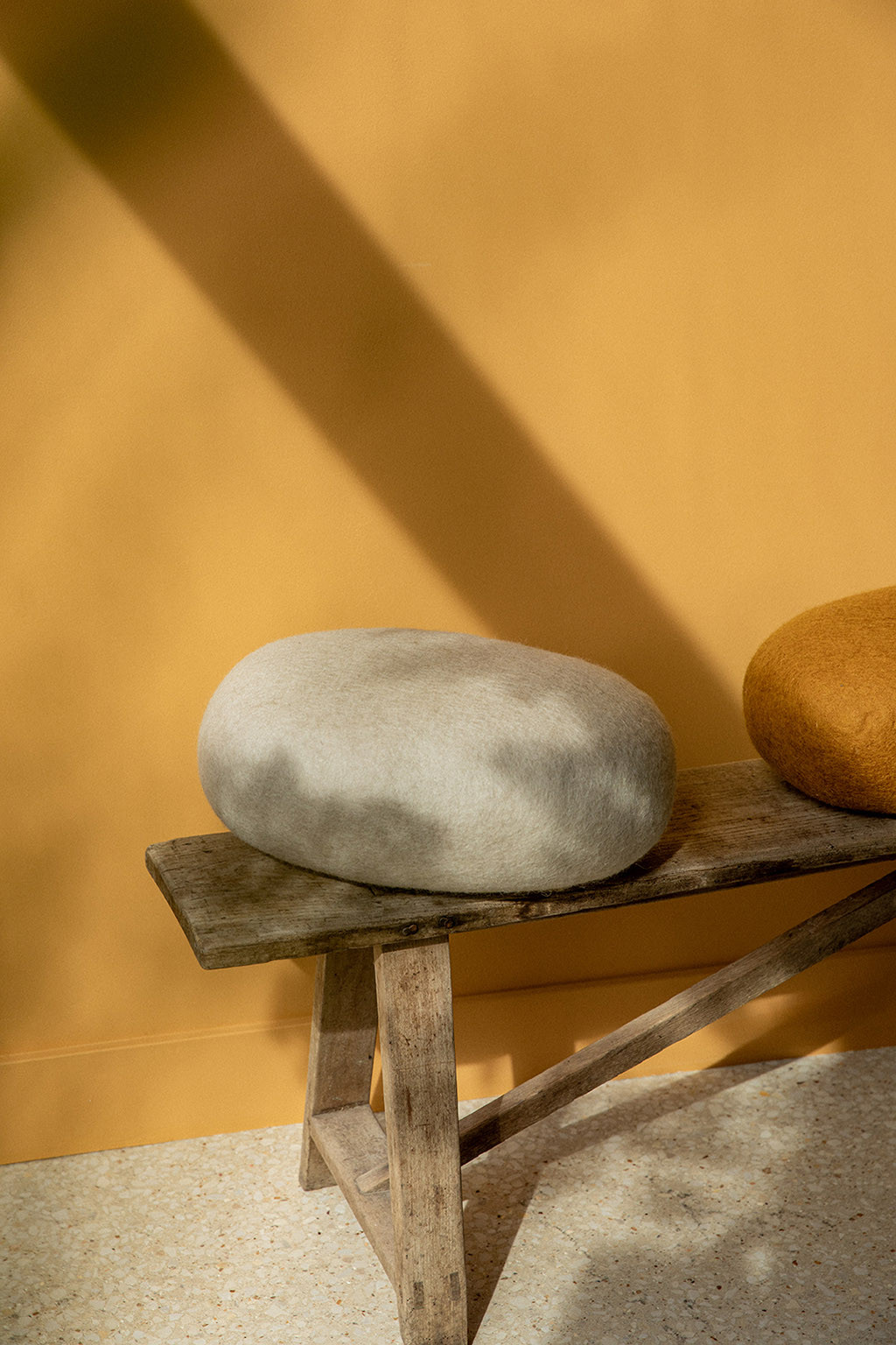 Felt wool cushions on a bench in the sun