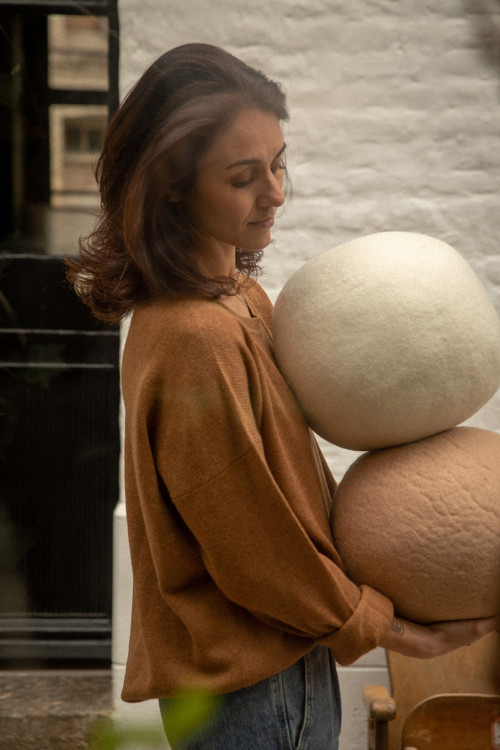 The soft colors of our felted wool poufs