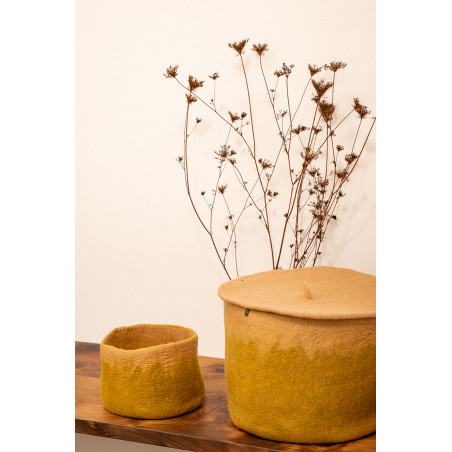 a cover to hide your items in this felted wool basket