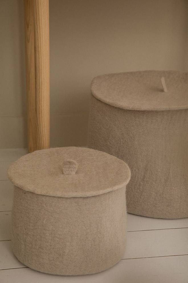 a cover to hide your items in this felted wool basket