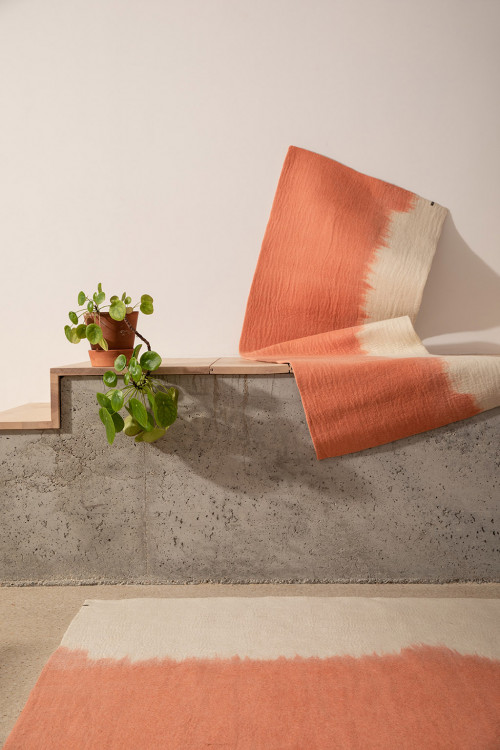 Duo of rectangular pink and white wool felt rugs for the home