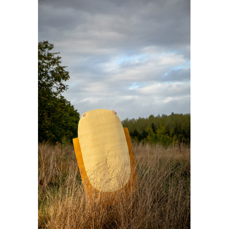 Two-tone oval wool felt carpet in yellow and ochre for a modern decoration