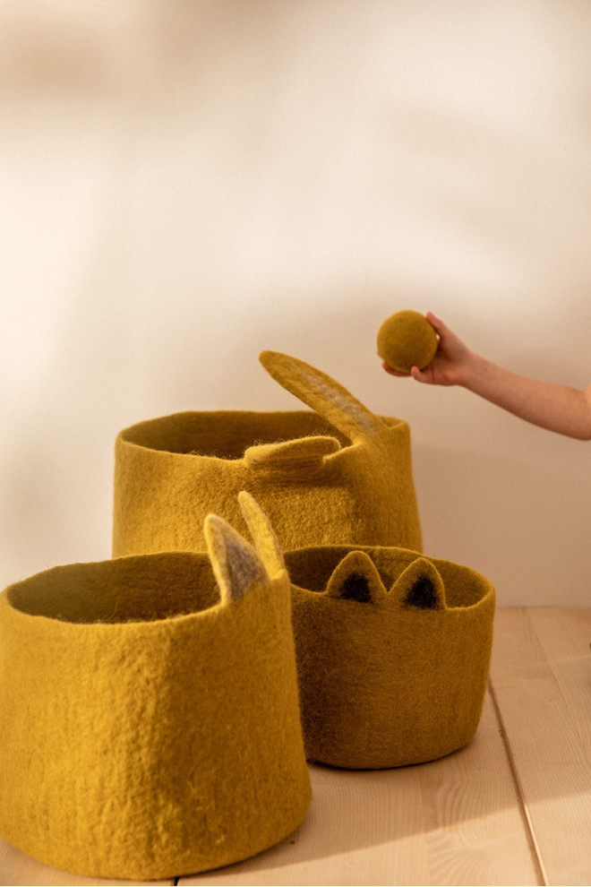 a comforter stored in its felt basket