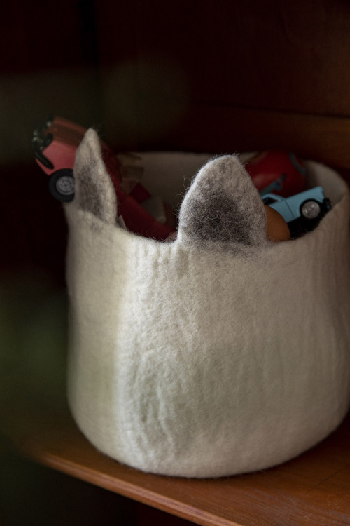 a storage basket with fox ears useful for storing children's toys