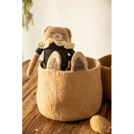 a comforter stored in its felt basket
