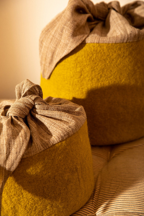 a basket mixing two natural materials: felted wool and nettle fiber