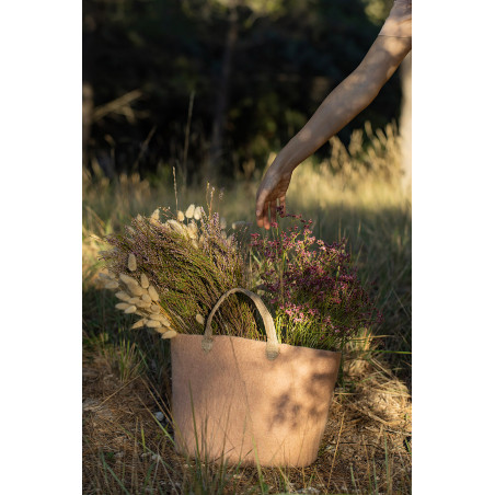 field flowers in a pink felt bag