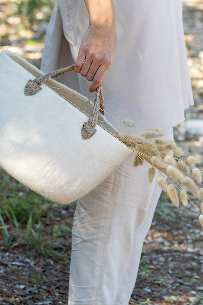 field flowers in a pink felt bag