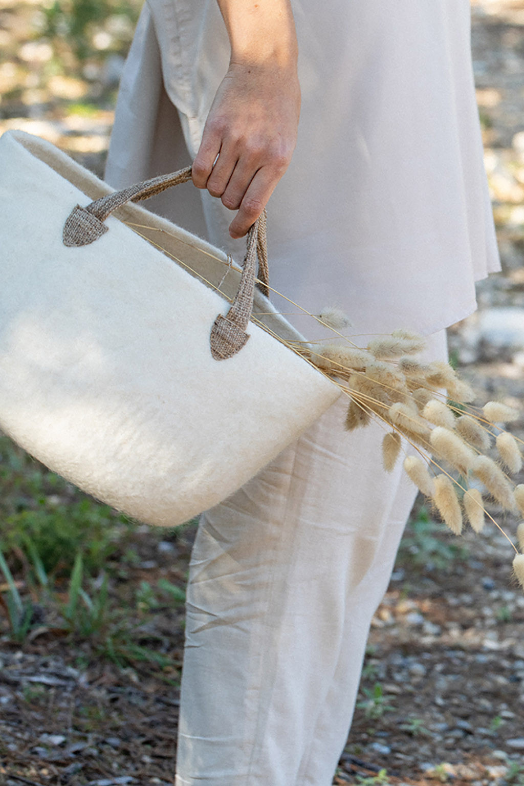 a small felt bag used to collect flowers from the garden