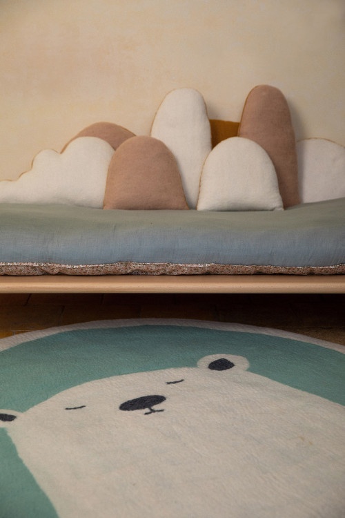 Blue and white felted wool bear rug for a playful atmosphere in the children's room