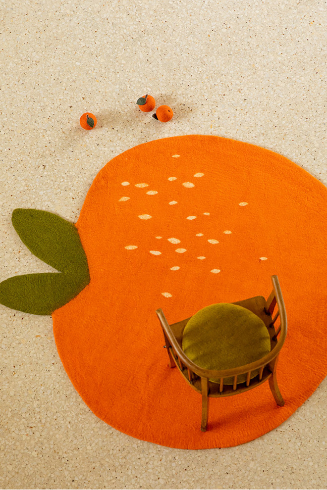 Clementine orange wool felt carpet to insulate from the cold floor