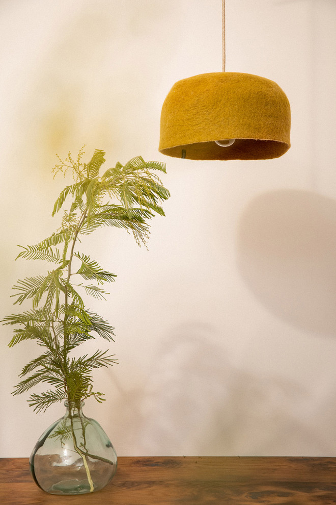 Trio of wool felt shades above the dining table