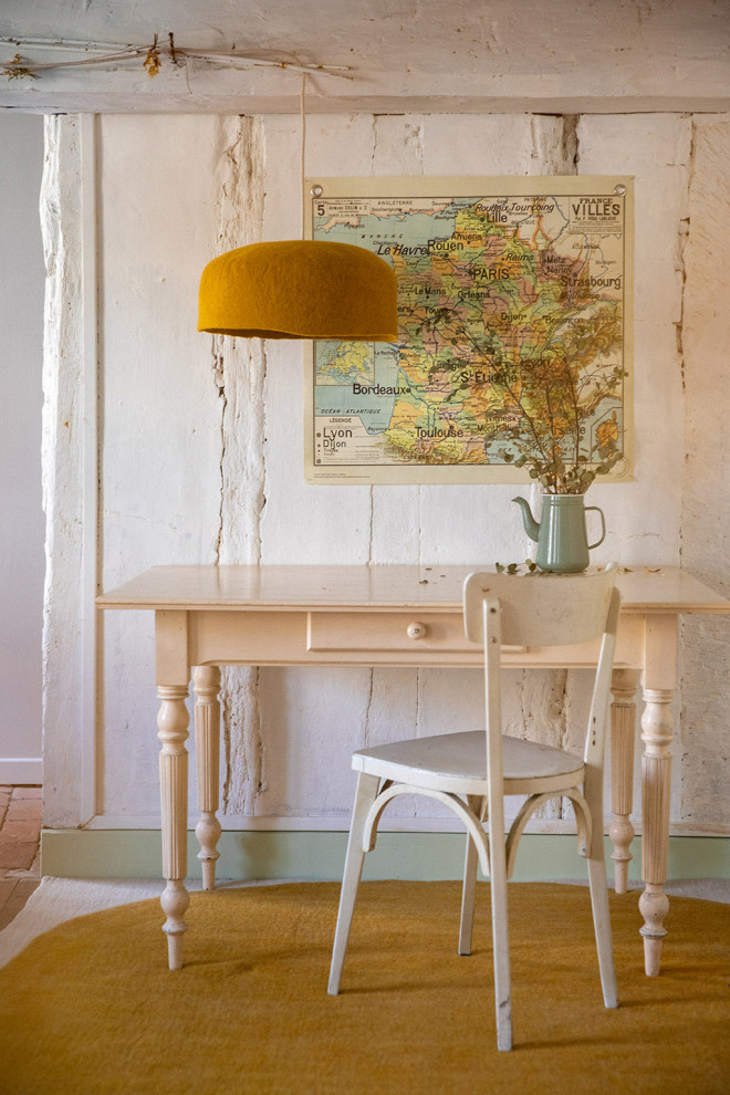 Trio of wool felt shades above the dining table