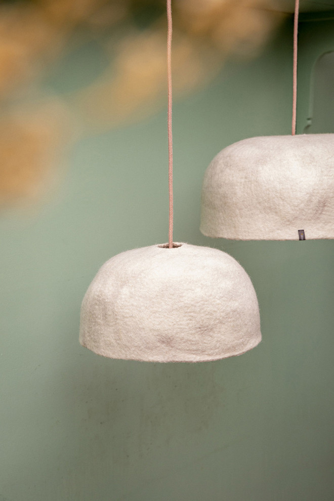 Trio of wool felt shades above the dining table