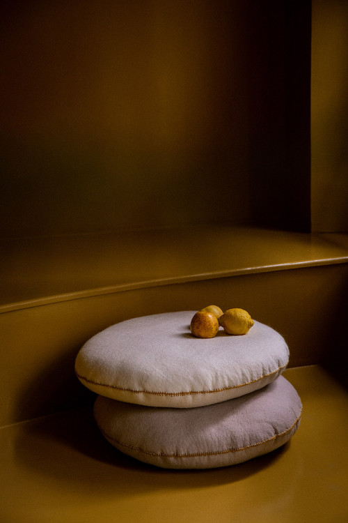 Two felt cushions on the floor for a warm atmosphere Two felt cushions on the floor for a warm atmosphere