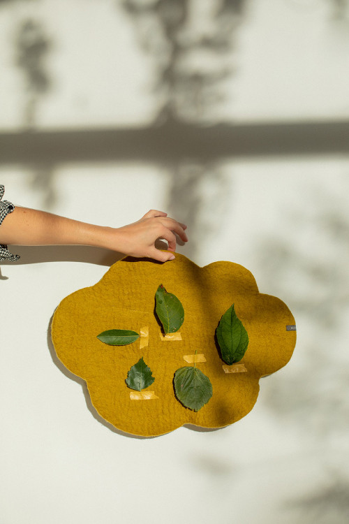Yellow cloud bulletin board made of wool ball to hang on the wall Yellow cloud bulletin board made of wool ball to hang on the wall