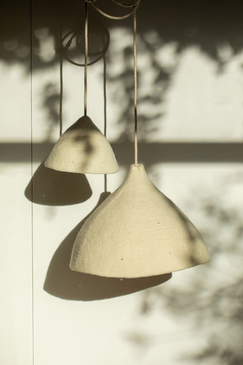 Duo of perforated felt lampshades for a soft light