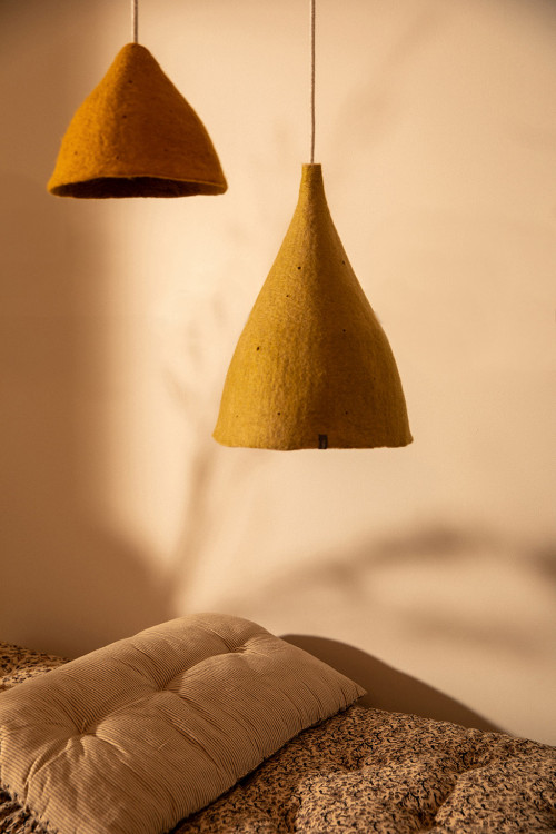 Duo of colourful wool felt hanging lamps for a cosy bedroom