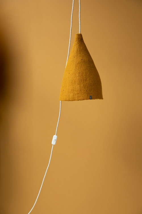 A wool felt accent lamp in the bedroom