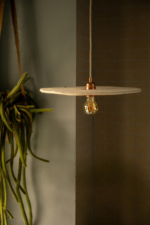 A hanging lamp made of handmade felted wool, airy and light