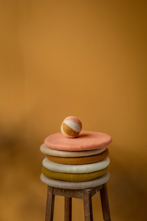 Felt ball placed on a pile of chair cushions. Felt ball placed on a pile of chair cushions.