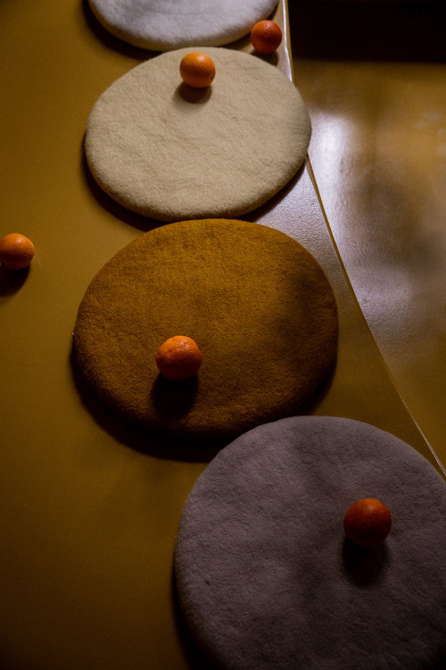Felt round cushions for a playful decoration