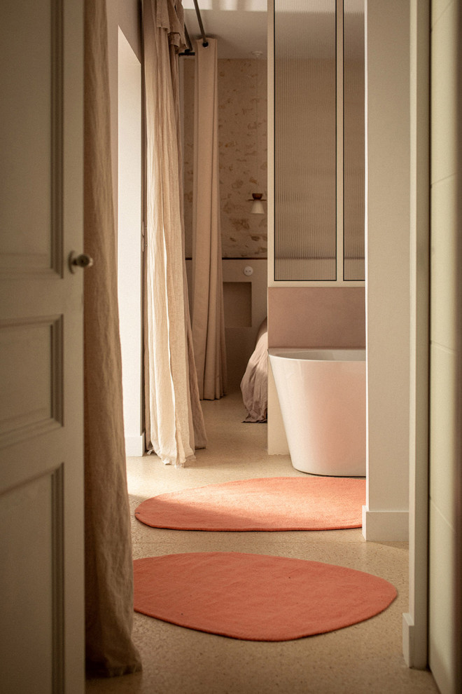 Duo of natural felt pebble rugs on the way to the bathroom