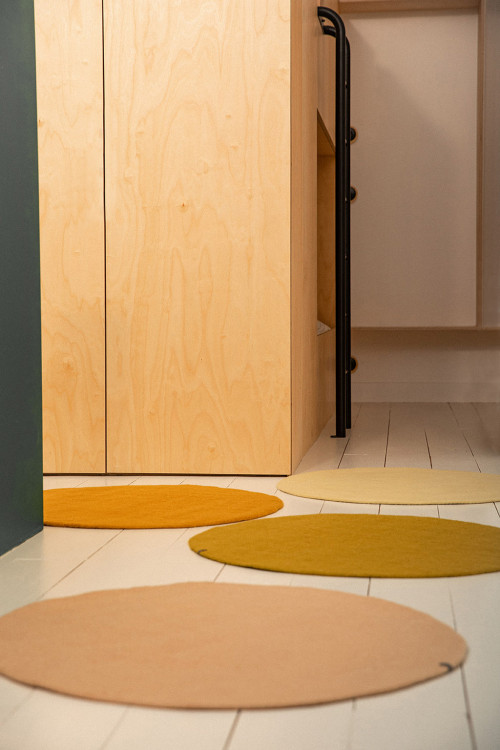 4 small round wool felt rugs in a room 4 small round wool felt rugs in a room