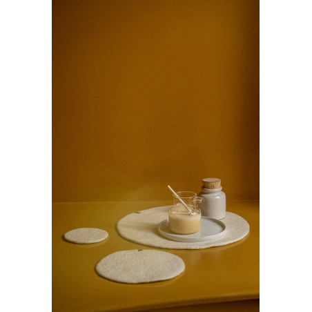 Trio of beige wool felt placemats