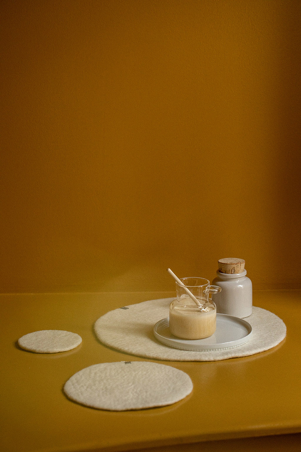 Trio of beige wool felt placemats