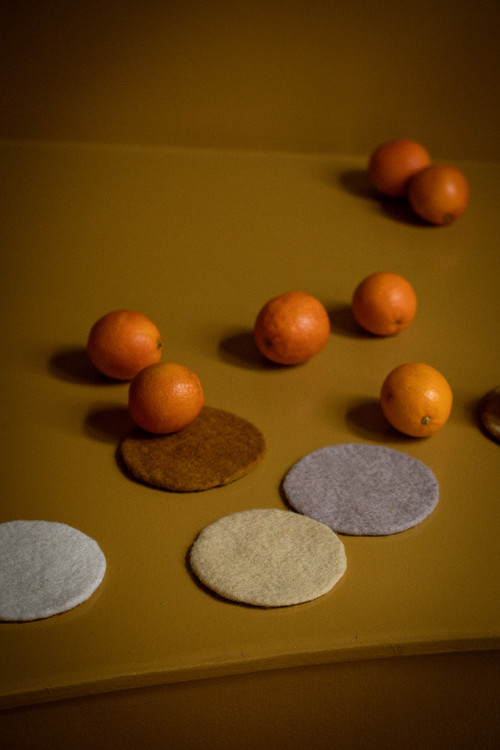 Set of coloured felt coasters for table decoration