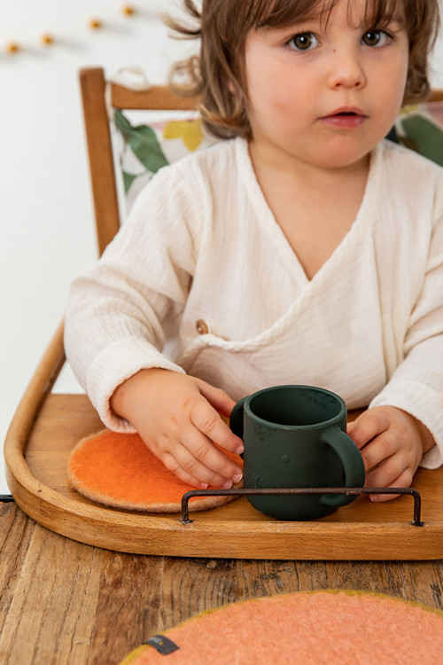 A two-coloured felt coaster for the children's table