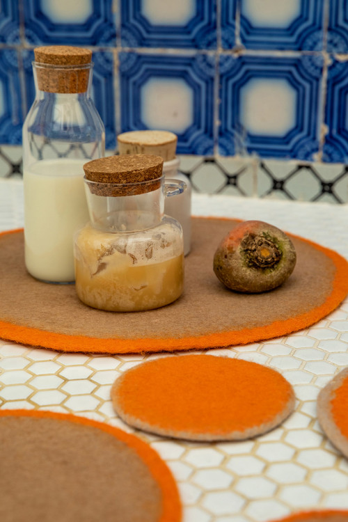 Placemats and orange felt pads for the kitchen