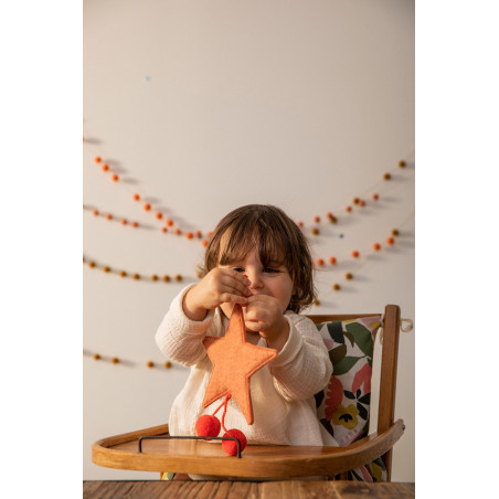 touch this soft and colorful wool star to bring color to your home