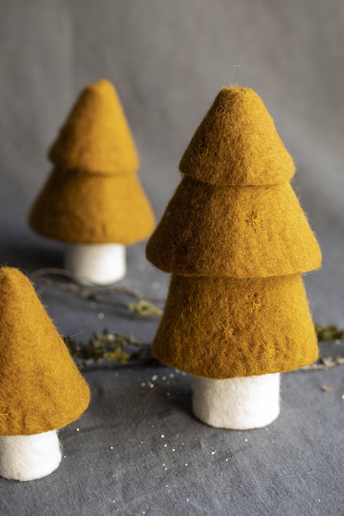 three ochre fir trees handmade in boiled wool