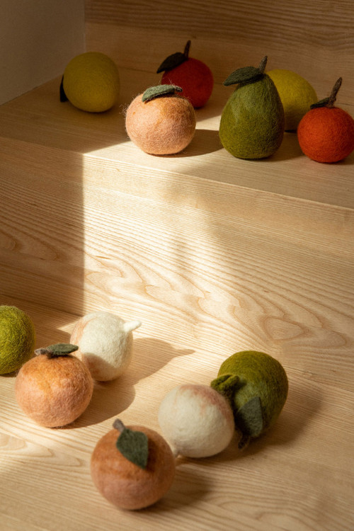 Felt fruits and vegetables decorate an interior