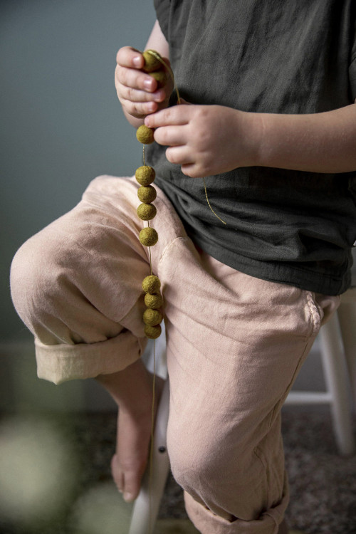 move the felt balls on the thread of the garland as you wish