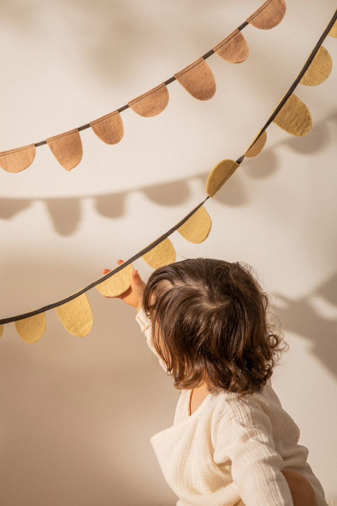 ochre felt garland with strappy sandals