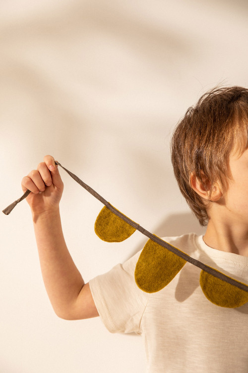 a khaki round felt pennant garland handmade in natural felt